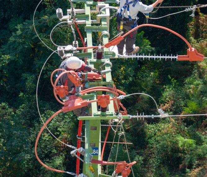 a man in a white shirt is on a high wire